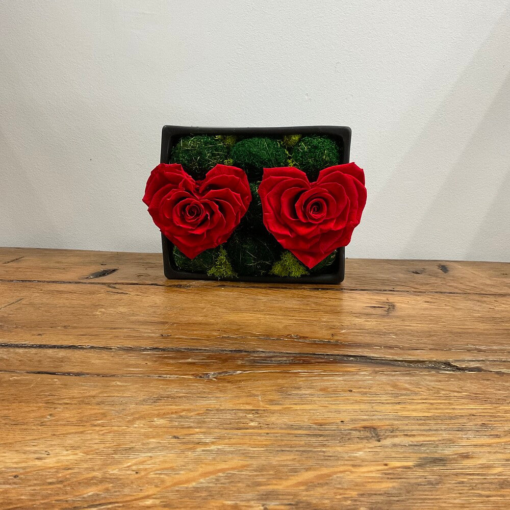 Red Preserved Rose Hearts in Black Ceramic Vase