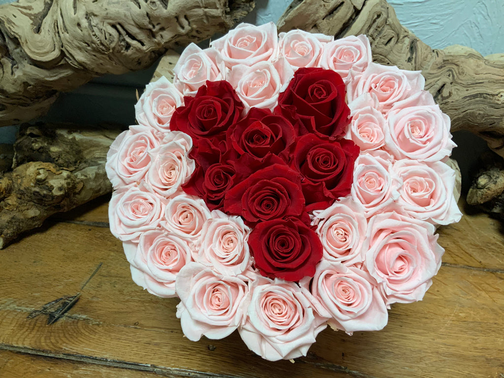 Pink Preserved Roses with Center formed with Red Roses in Pink Hat Box