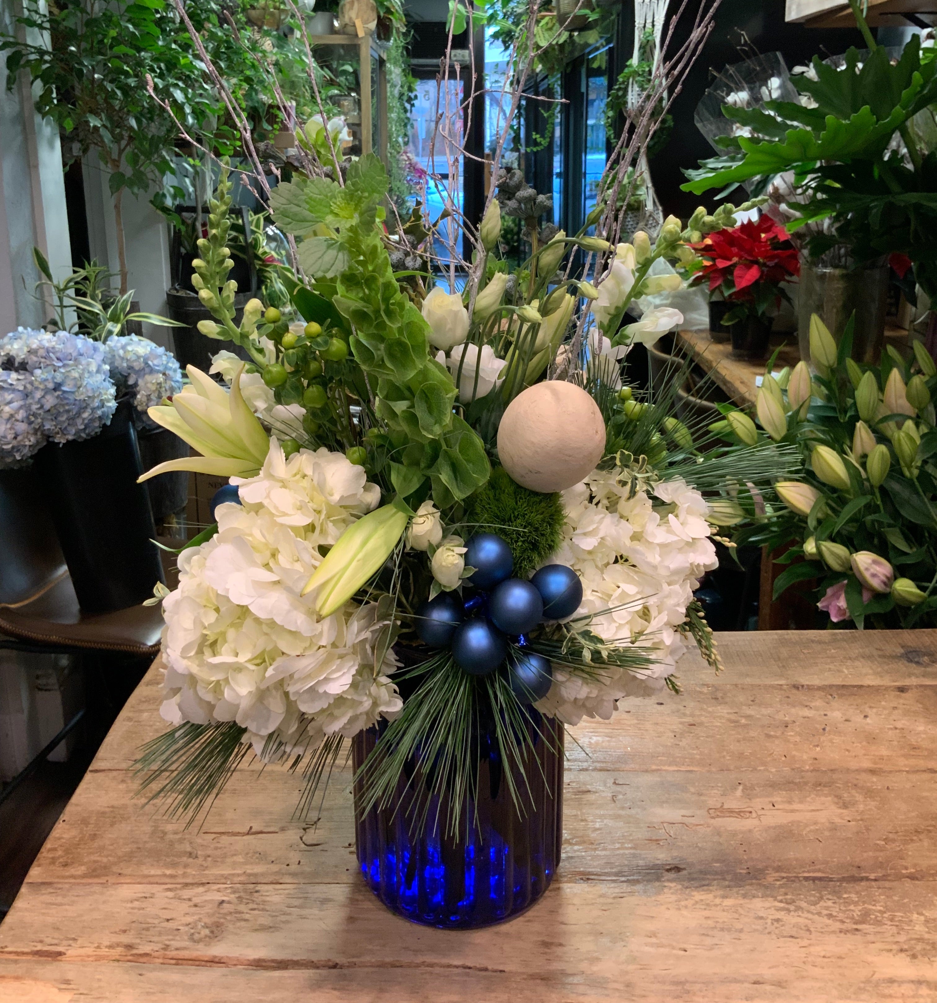 White with Blue Baubles in Upright Cobalt Vase