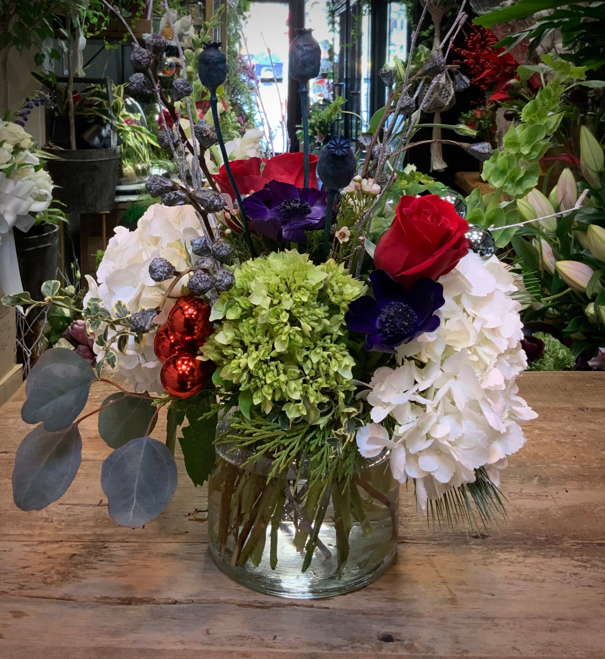 Warm & Cozy - Mixed Hydrangea with Red Roses and Bells of Ireland in a Glass Vase
